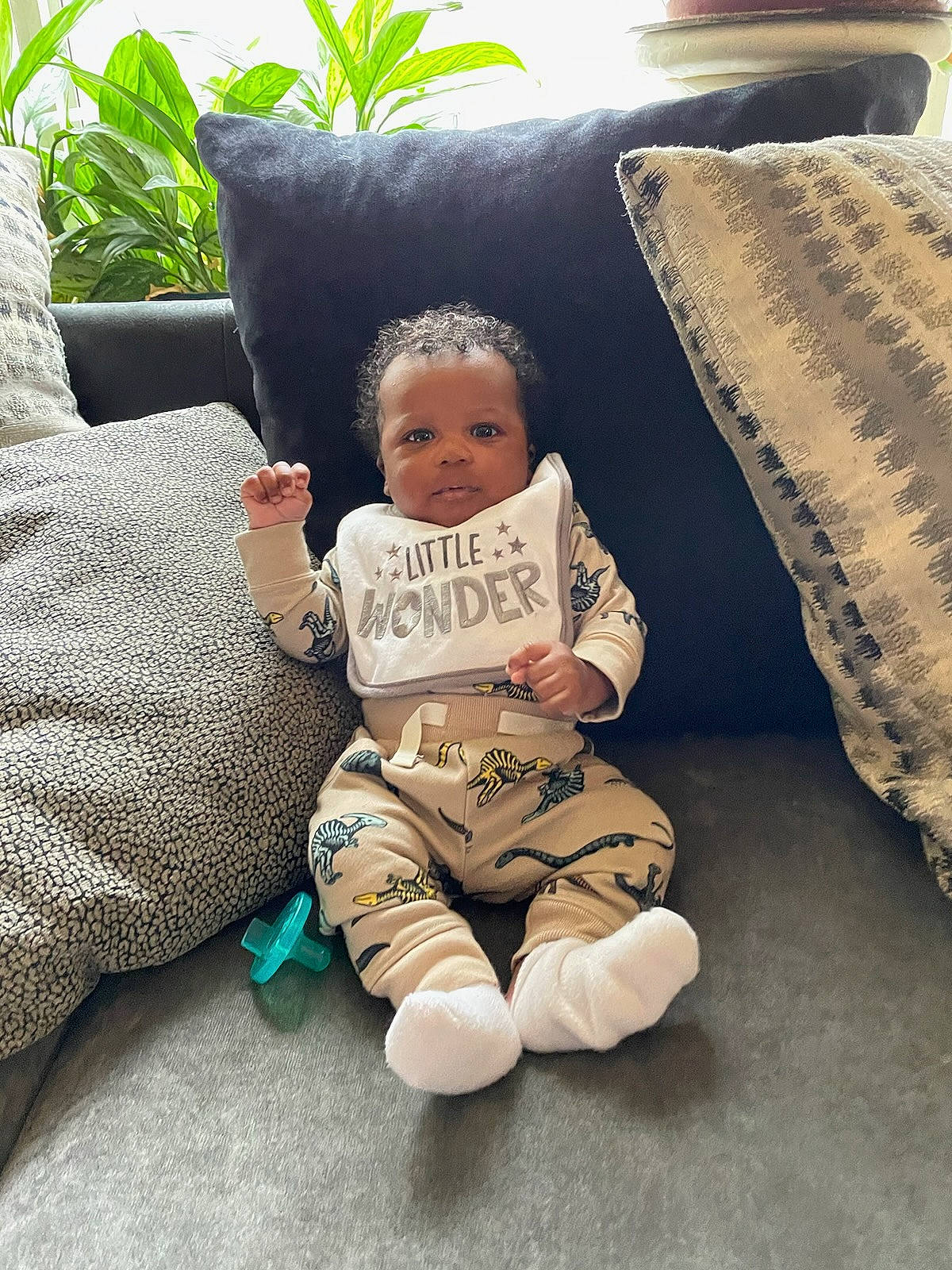 Kauron joined the competition — help win amazing prizes! baby, baby_toddler_clothing, child, comfort, couch, foot, grass, happy, head, human_body, knee, linens, person, pillow, plant, sitting, skin, sleeve, thigh, throw_pillow