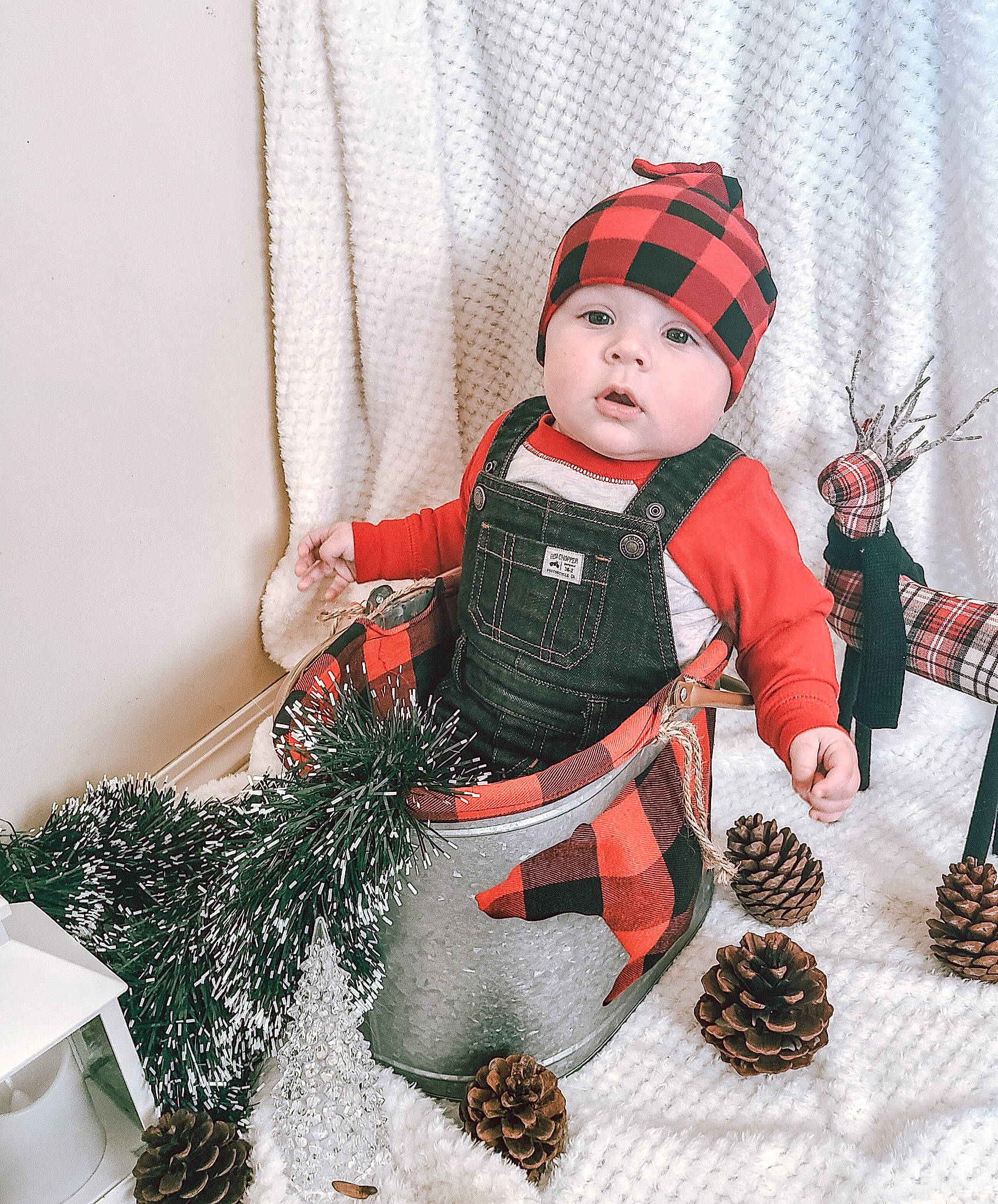 Björn is registered to the contest to win money with this photo: art, baby, baby_toddler_clothing, beanie, cap, carmine, child, costume_hat, doll, fashion_accessory, fashion_design, fur, headwear, pattern, person, personal_protective_equipment, sleeve, toddler, toy, white