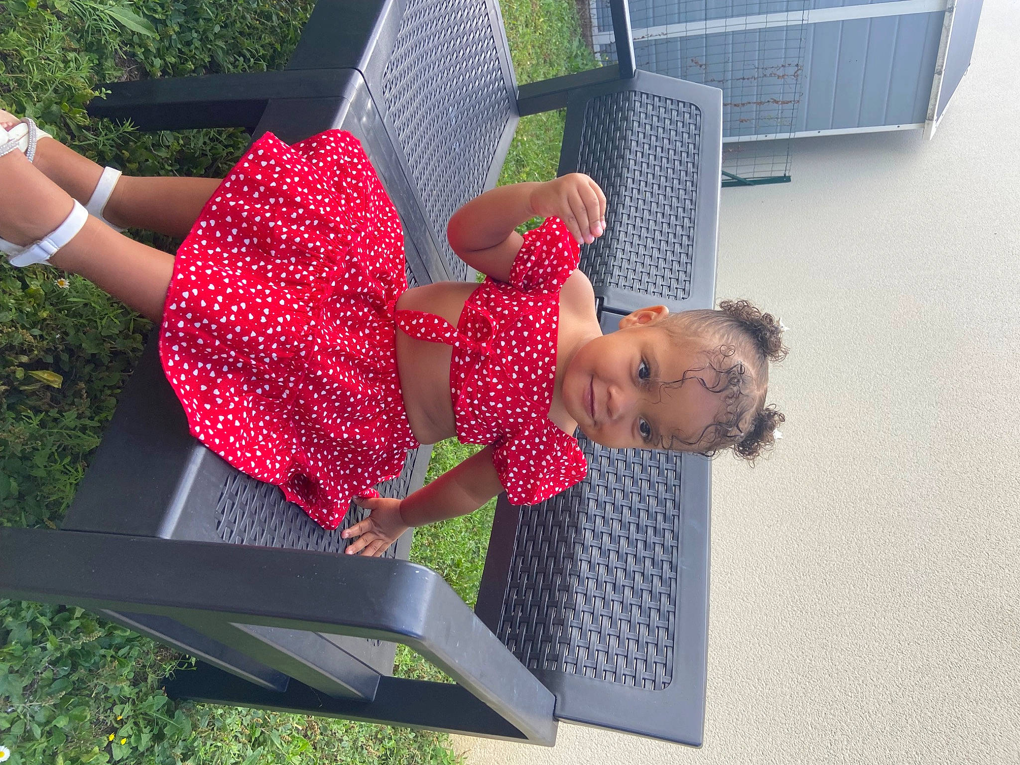 Kaelyn participe au concours pour gagner de l'argent avec cette photo : comfort, fun, grass, human_leg, joy, leisure, magenta, outdoor_furniture, pattern, people_in_nature, person, polka_dot, sitting, thigh, toddler, waist