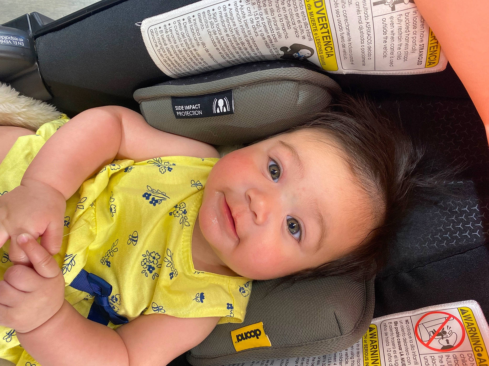 Jade is registered to the contest to win money with this photo: baby, baby_carriage, baby_products, baby_toddler_clothing, cheek, child, comfort, eye, facial_expression, finger, gesture, happy, head, human, person, sitting, skin, smile, thumb, toddler