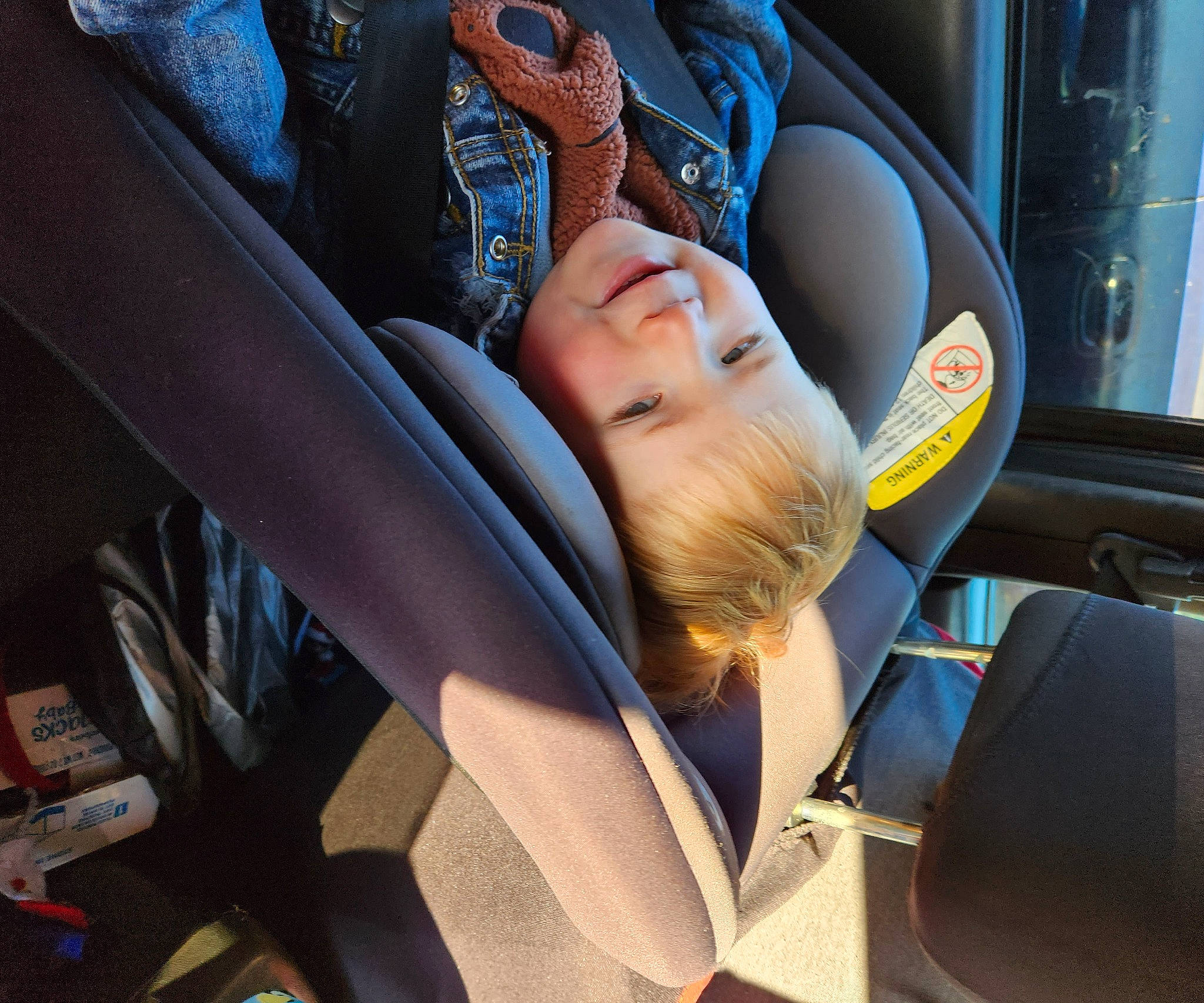 Harrison is registered to the contest to win money with this photo: auto_part, automotive_design, automotive_exterior, automotive_window_part, car, car_seat, car_seat_cover, comfort, electric_blue, family_car, head_restraint, mode_of_transport, motor_vehicle, person, seat_belt, smile, steering_part, toddler, vehicle, vehicle_door