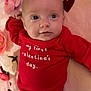 baby, infant, valentine, hearts, pink_blanket, flowers, red_shirt, blue_eyes, gaze, portrait, lying_down, cute, newborn, soft_texture, plush, small_hand, smile, close_up, holiday, cozy
