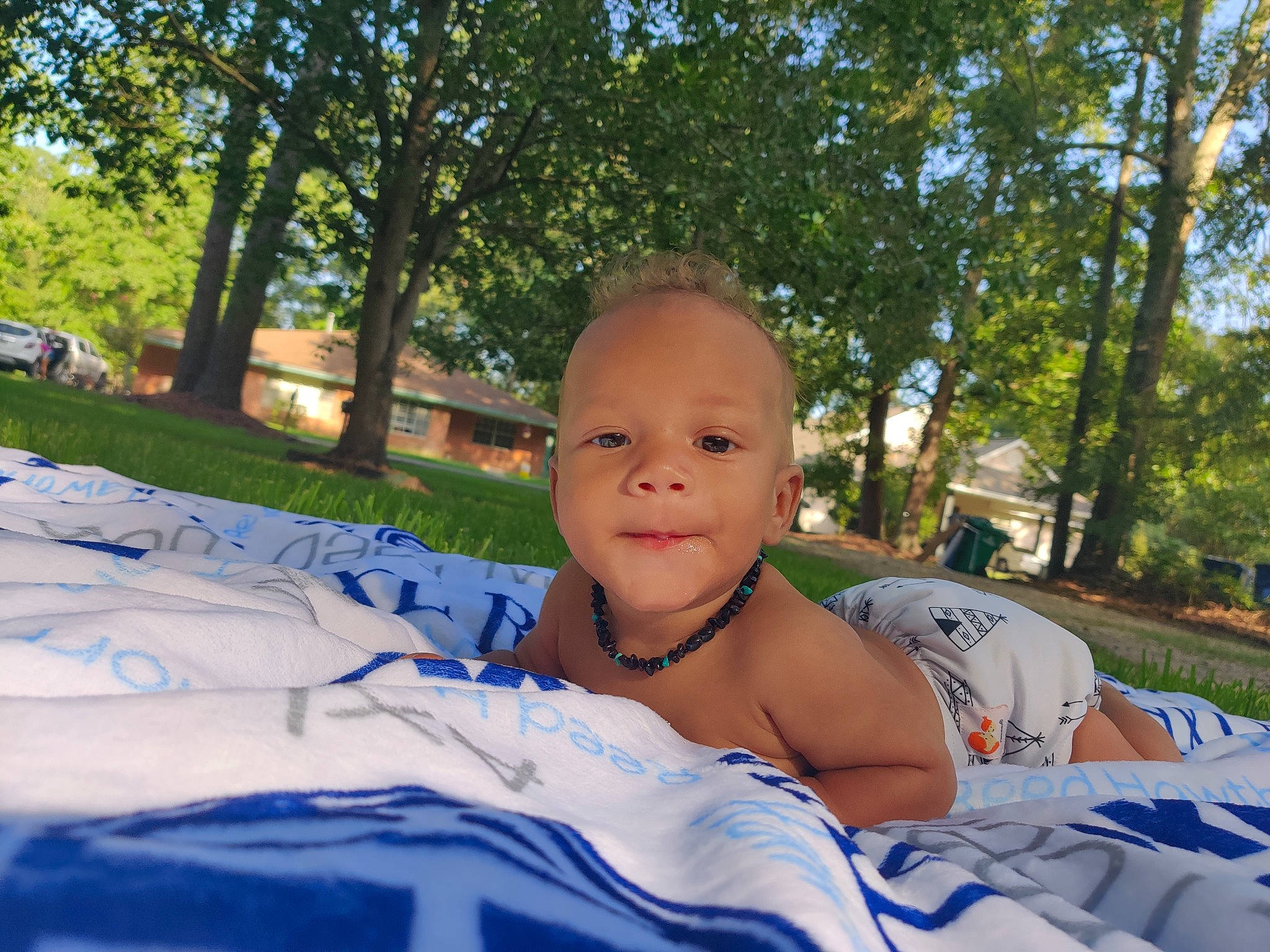 Axl joined the competition — help win amazing prizes! baby, child, cool, eye, face, grass, head, leaf, leisure, muscle, person, photography, picnic, plant, recreation, sitting, smile, summer, toddler, tree