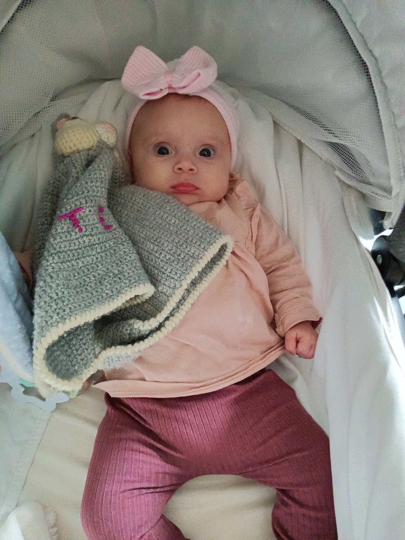 Tessa participe au concours pour gagner de l'argent avec cette photo : baby, baby_products, baby_toddler_clothing, cap, cheek, comfort, doll, fashion_accessory, fur, iris, knit_cap, linens, lip, outerwear, person, pink, skin, sleeve, toddler, white