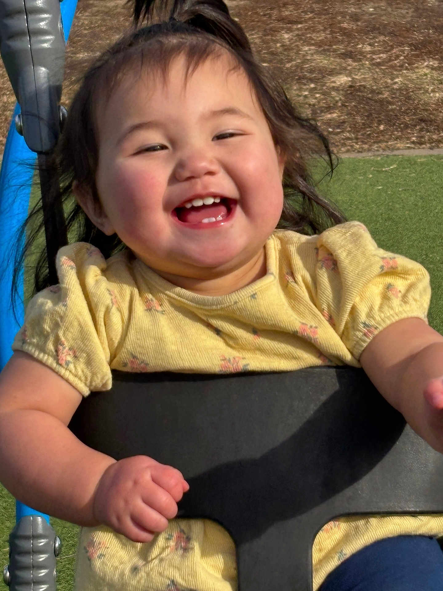 Aera joined the competition — help win amazing prizes! baby, child, cute, face, fun, grass, hair, happy, joyful, outdoor, park, person, play, playground, puffy_cheeks, smiling, sunlight, swing, toddler, yellow_dress