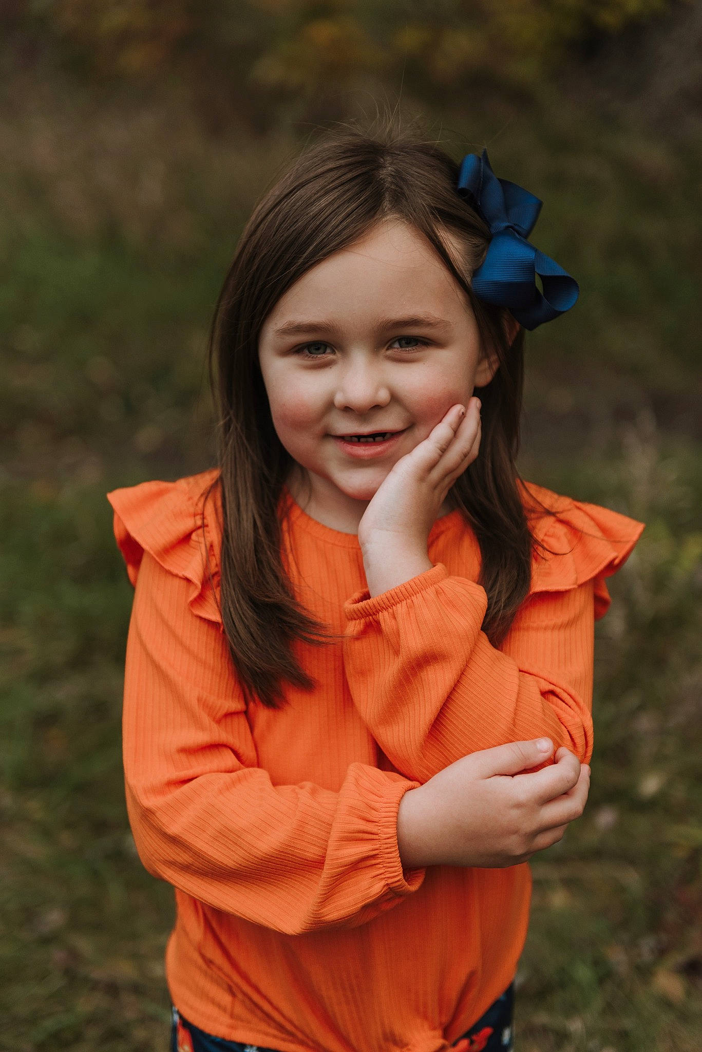 Gabriella joined the competition — help win amazing prizes! brown_hair, child, clothing, eye, face, flash_photography, fun, gesture, grass, grassland, happy, joy, lip, long_hair, people_in_nature, person, plant, skin, sleeve, smile