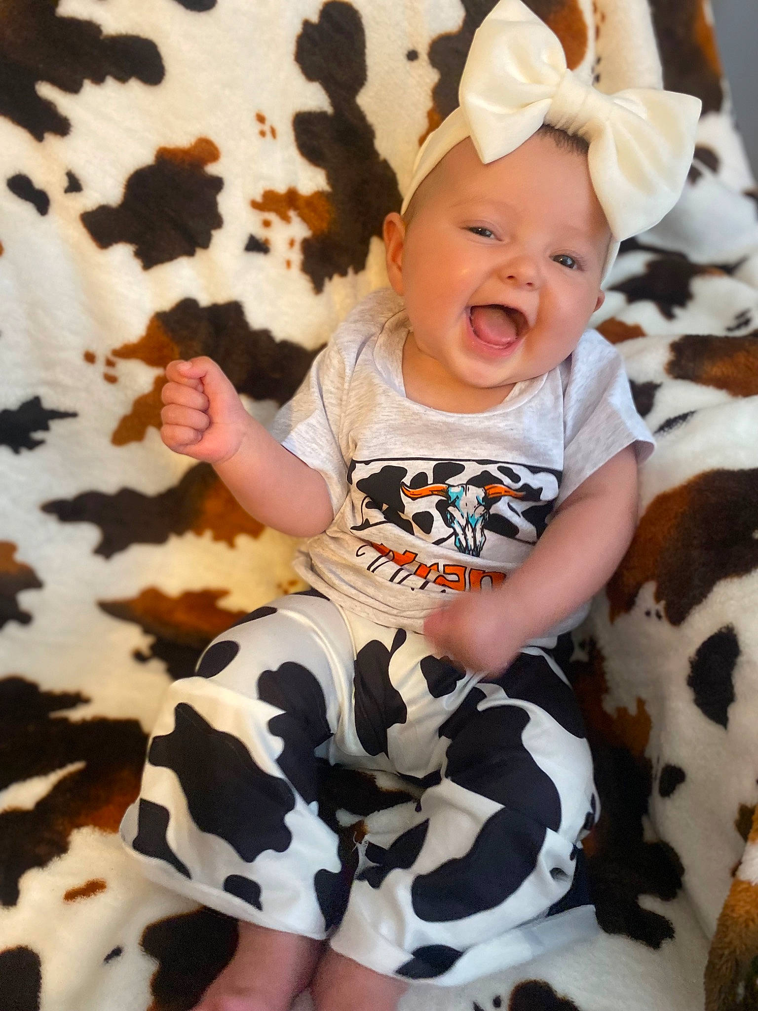 Jurnee is registered to the contest to win money with this photo: arm, baby, baby_toddler_clothing, beauty, child, eye, face, fun, gesture, grass, happy, headwear, pattern, person, pink, sitting, sleeve, smile, t_shirt, thigh