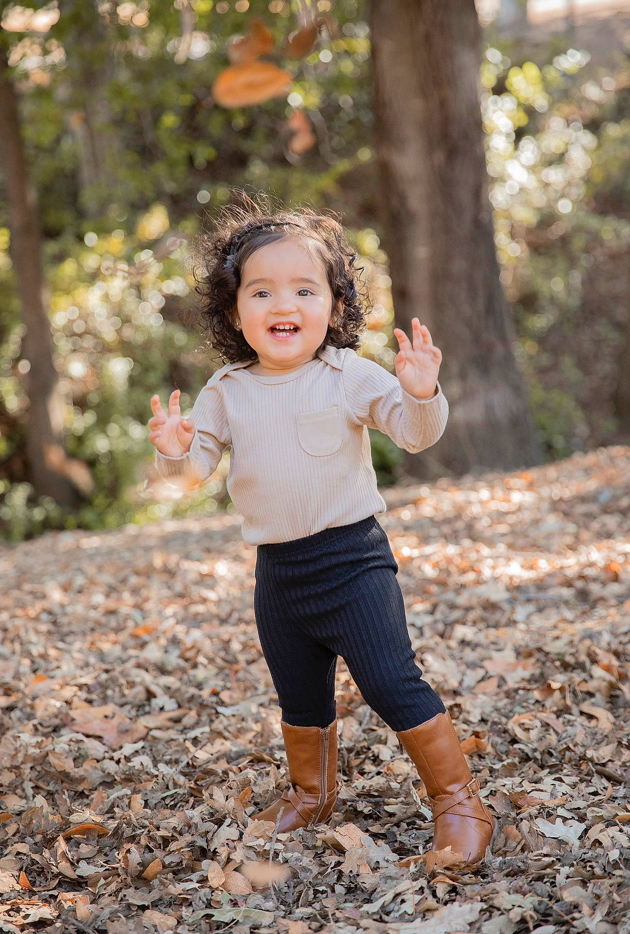 Ariah joined the competition — help win amazing prizes! branch, flash_photography, forest, fun, gesture, grass, happy, leisure, people_in_nature, person, plant, recreation, shorts, smile, sunlight, t_shirt, toddler, tree, trunk, wood