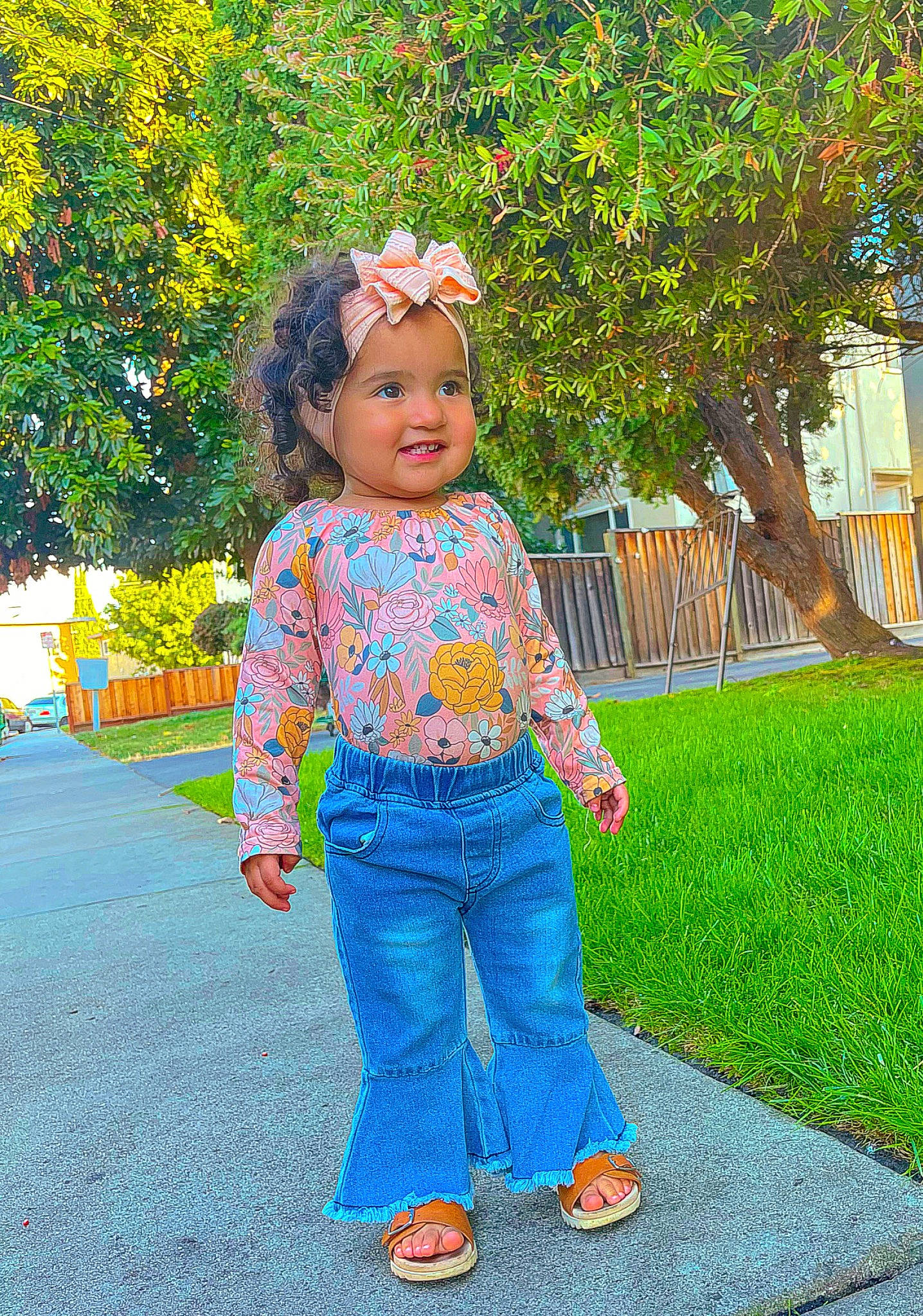 Ariah is registered to the contest to win money with this photo: child, clothing, denim, flower, fun, grass, happy, headwear, jeans, joy, leisure, people_in_nature, person, plant, recreation, sleeve, smile, summer, toddler, tree