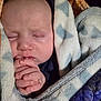 Oliver is registered to the contest to win money with this photo: baby, infant, blanket, sleeping, hands, face, closeup, soft, cozy, pattern, warm, child, cute, newborn, wrapped, peaceful, skin, portrait, rest, comfort