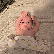 Oliver joined the competition — help win amazing prizes! baby, blanket, bed, bedding, person, infant, face, arm, skin, blue_eyes, expression, lying_down, soft_texture, pattern, comfort, sleepwear, cute, indoors, newborn, resting