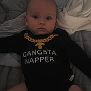 Mason joined the competition — help win amazing prizes! baby, baby_bodysuit, bed, bedding, black_clothing, blanket, chubby_legs, cute, diaper, eyes, face, indoor, infant, lying_down, nap, neutral_expression, onesie, quilt, text_on_clothing, white_cloth