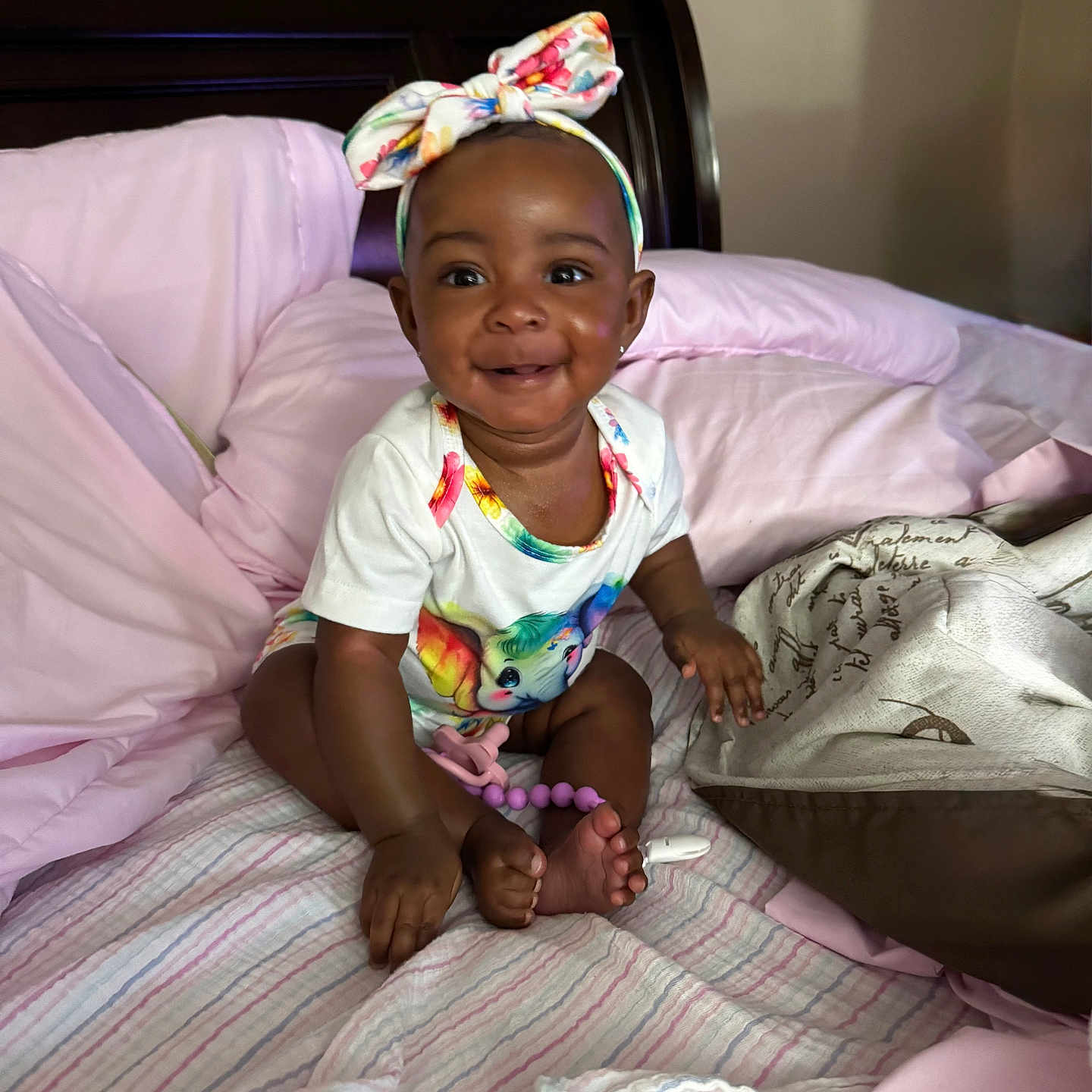 Kymbrielle joined the competition — help win amazing prizes! baby, bed, blanket, child, clothing, cute, foot, furniture, hand, happy, headband, indoor, infant, onesie, person, pillow, portrait, skin, smiling, unicorn