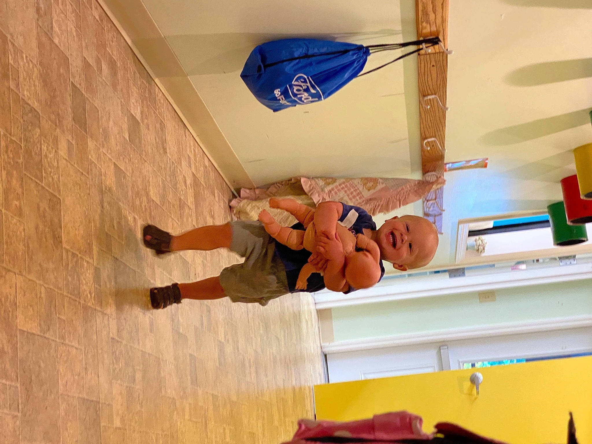 Waylon is registered to the contest to win money with this photo: building, ceiling, child, comfort, floor, flooring, fun, handrail, hardwood, house, human_leg, knee, person, plaster, room, stairs, t_shirt, thigh, toddler, walking_shoe