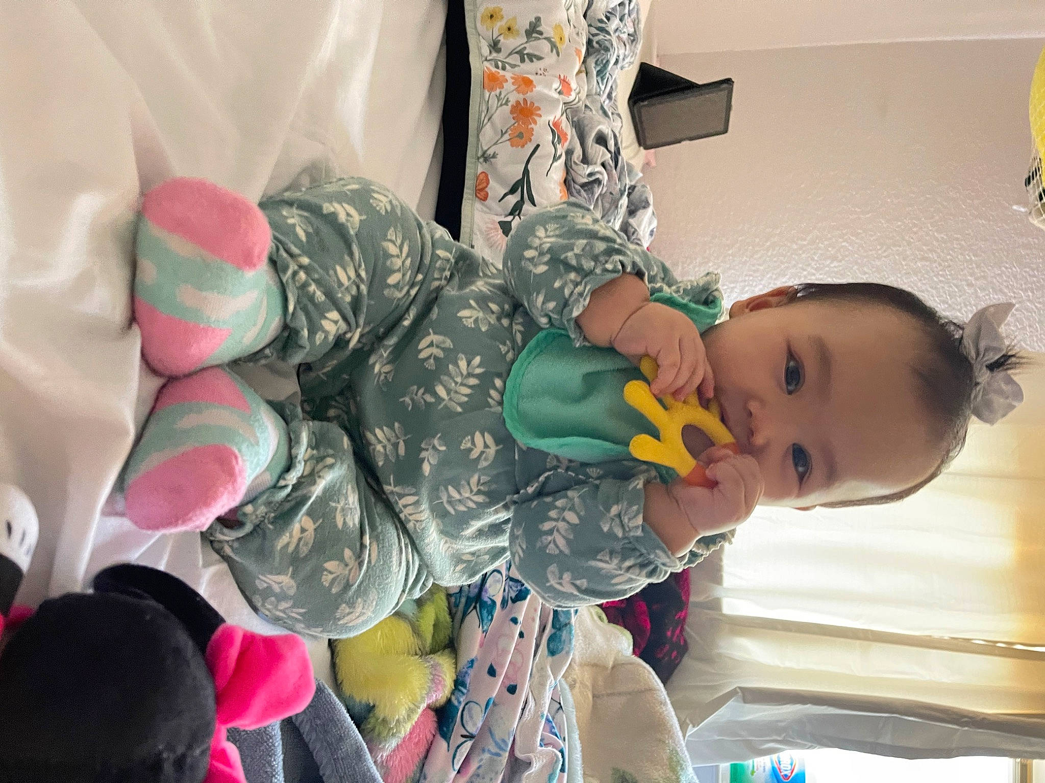 Emilia is registered to the contest to win money with this photo: baby, camouflage, child, event, fun, gesture, happy, hat, military, military_camouflage, military_uniform, pattern, person, plastic, play, room, sitting, toddler