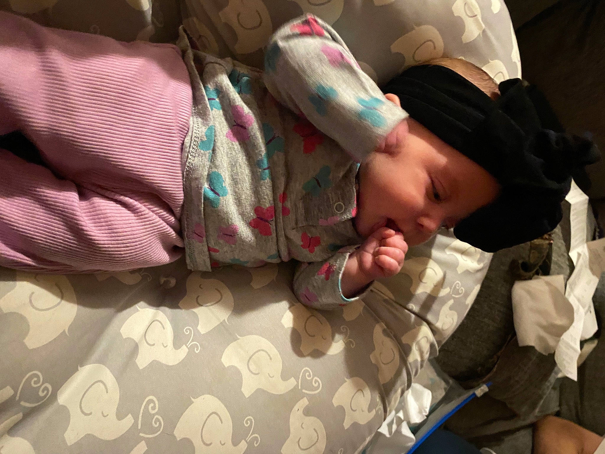 Kaliah is registered to the contest to win money with this photo: arm, baby, baseball_cap, black_hair, child, comfort, fedora, finger, fun, hat, mouth, pattern, person, plaid, room, sitting, skin, sun_hat, tartan, toddler