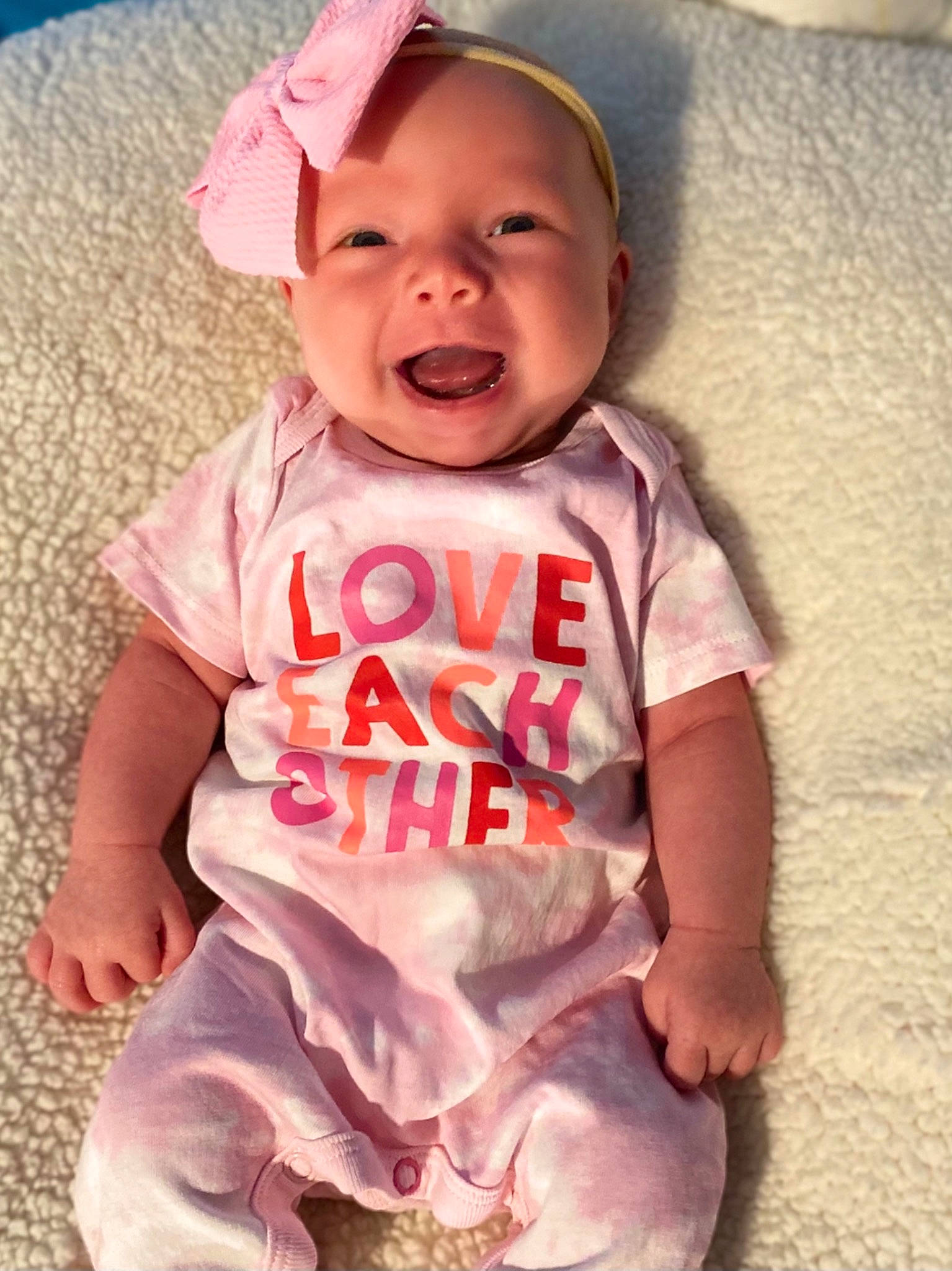 Alyza is registered to the contest to win money with this photo: baby, baby_toddler_clothing, cheek, chin, clothing, eye, face, finger, happy, head, linens, nose, pattern, person, pink, skin, sleeve, smile, t_shirt, textile