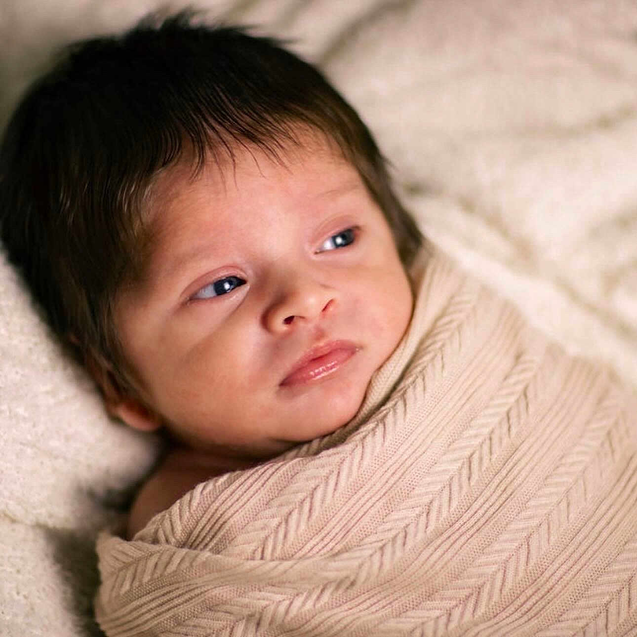 Isai is registered to the contest to win money with this photo: baby, blanket, crying, face, happy, head, newborn, person, photography, portrait, sad, skin, smile