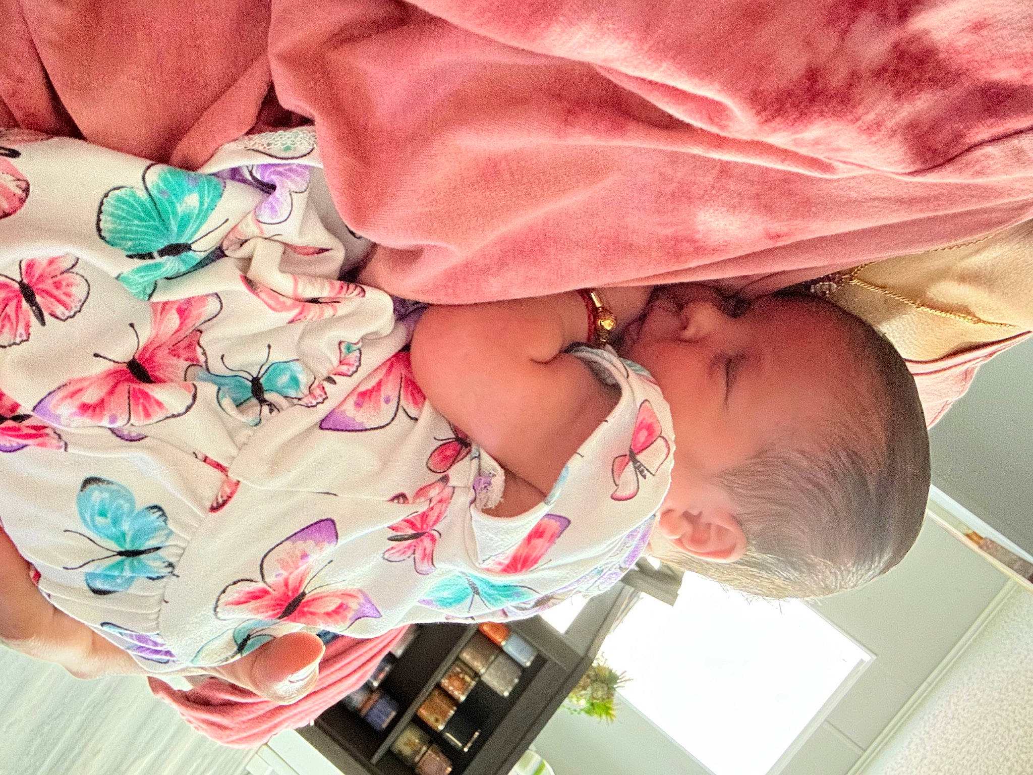 Hailey is registered to the contest to win money with this photo: baby, baby_products, baby_toddler_clothing, carmine, child, clothing, comfort, dress, fashion_accessory, finger, human_leg, magenta, nail, pattern, peach, person, pink, sleeve, thigh, toddler