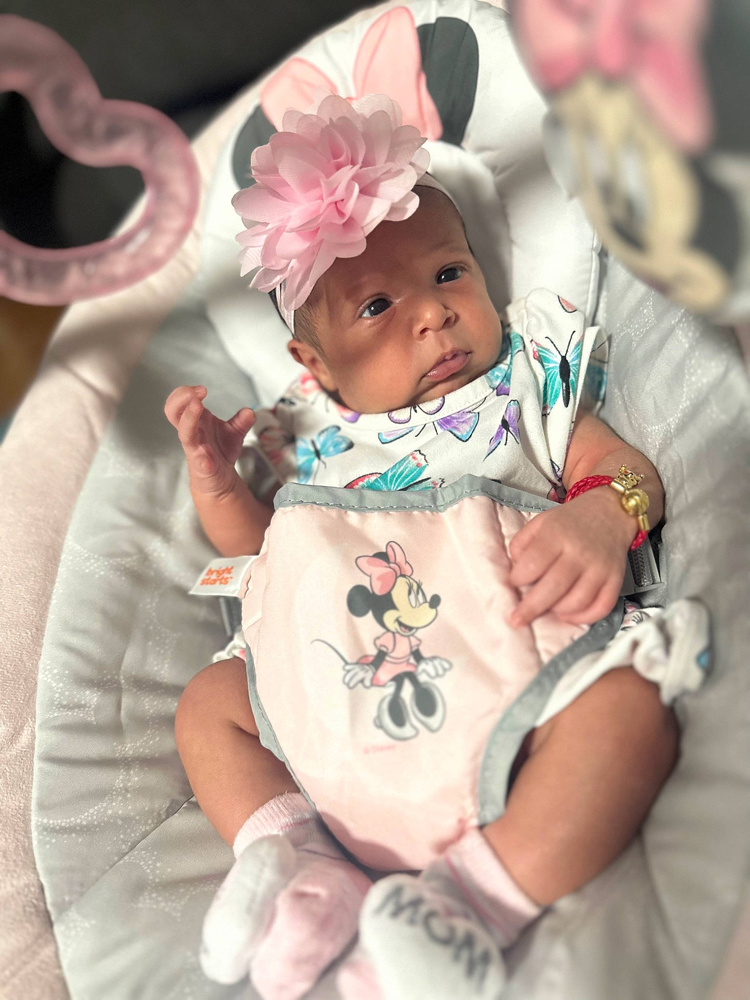 Hailey is registered to the contest to win money with this photo: baby, baby_products, baby_toddler_clothing, cheek, child, costume_hat, event, fashion_accessory, fun, happy, headpiece, headwear, jewellery, linens, peach, person, pink, sitting, skin, sleeve