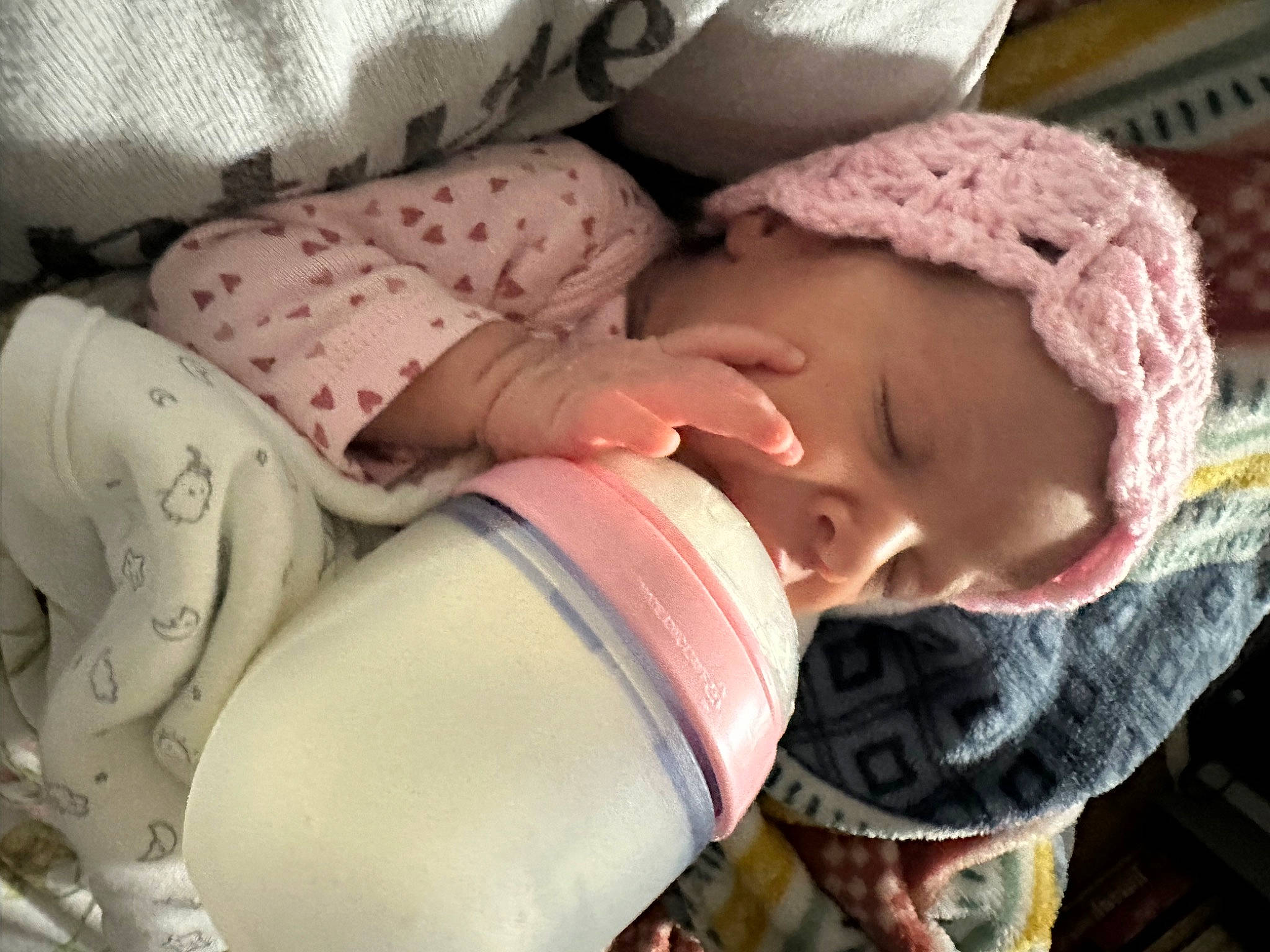 Hailey joined the competition — help win amazing prizes! baby, baby_toddler_clothing, beanie, cap, cheek, child, comfort, eyelash, fashion_accessory, knit_cap, linens, mouth, neck, pattern, person, pink, sitting, skin, sleeve, textile