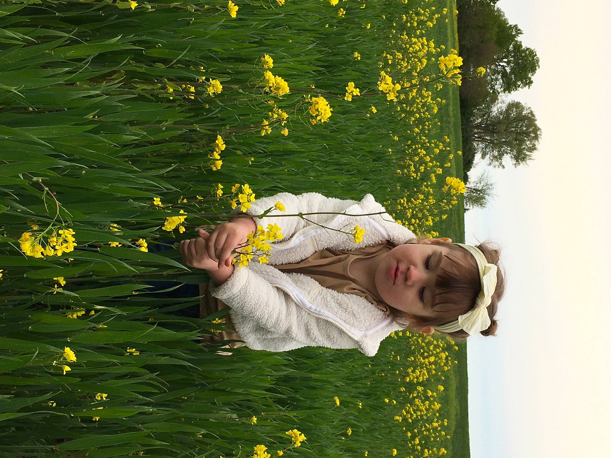 Reyna joined the competition — help win amazing prizes! flower, flowering_plant, grass, grassland, groundcover, happy, landscape, lawn, leaf, leisure, meadow, nature, people_in_nature, person, petal, plant, sky, smile, tree, vegetation