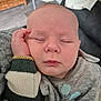 Oscar is registered to the contest to win money with this photo: baby, sleeping, hand, face, sweater, cozy, infant, peaceful, portrait, closeup, child, cute, skin, expression, indoors, soft, resting, young, person, nap