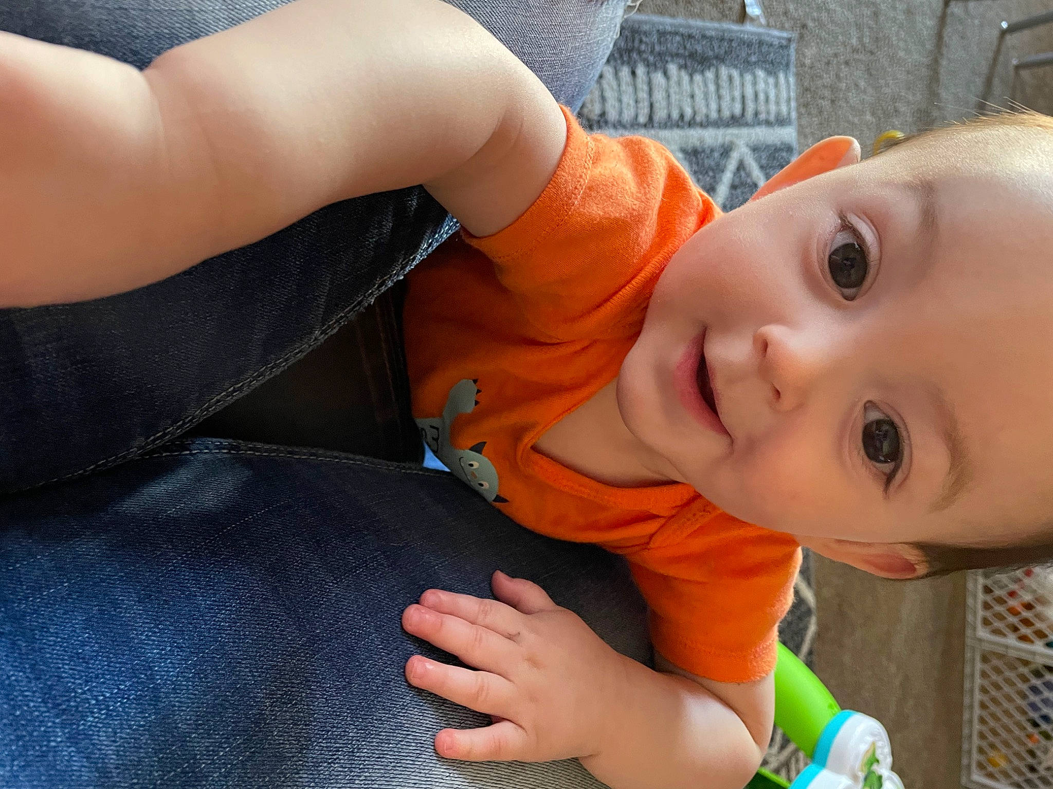 Giovanni is registered to the contest to win money with this photo: baby, baby_products, baby_toddler_clothing, cheek, child, elbow, face, finger, fun, gesture, grass, hand, happy, human_body, nose, person, sitting, smile, thumb, toddler