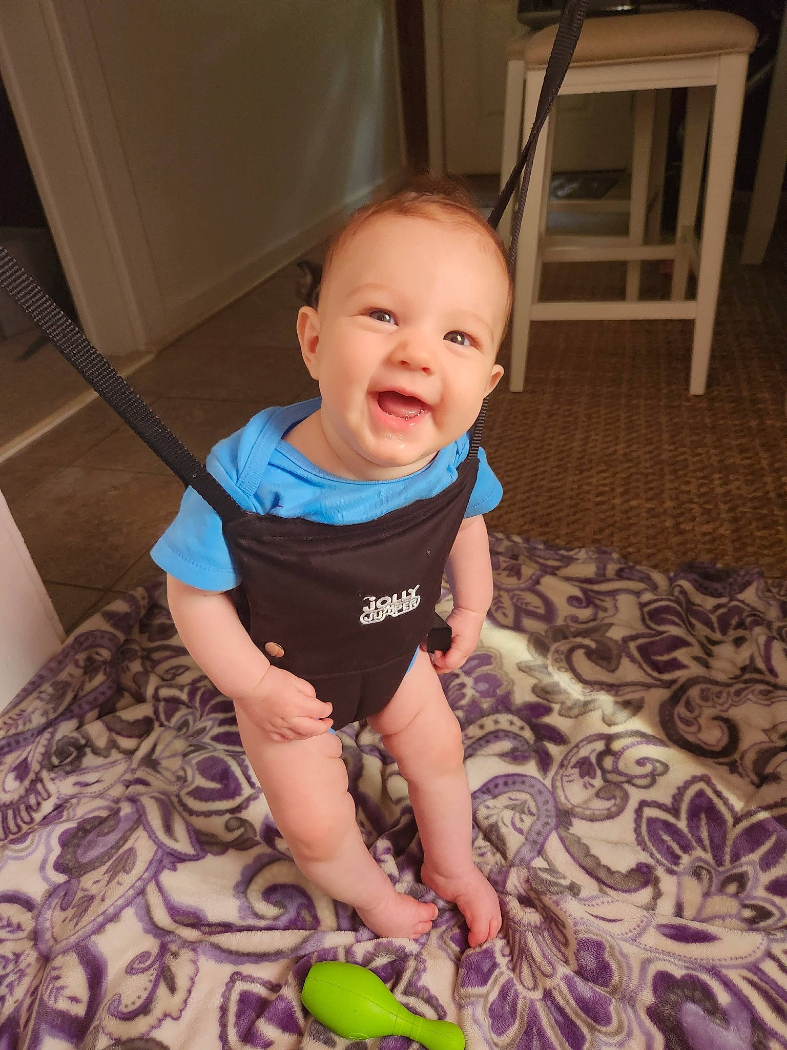 Lucy is registered to the contest to win money with this photo: baby, baby_toddler_clothing, ball, cheek, child, eye, face, floor, flooring, fun, happy, hardwood, human_leg, iris, joy, mammal, person, skin, sleeve, smile