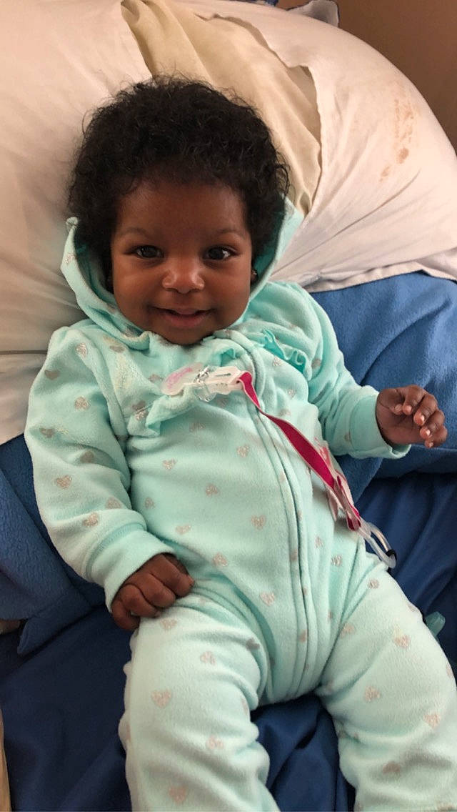 Nature is registered to the contest to win money with this photo: arm, baby, cheek, child, person, sitting, skin, smile, toddler