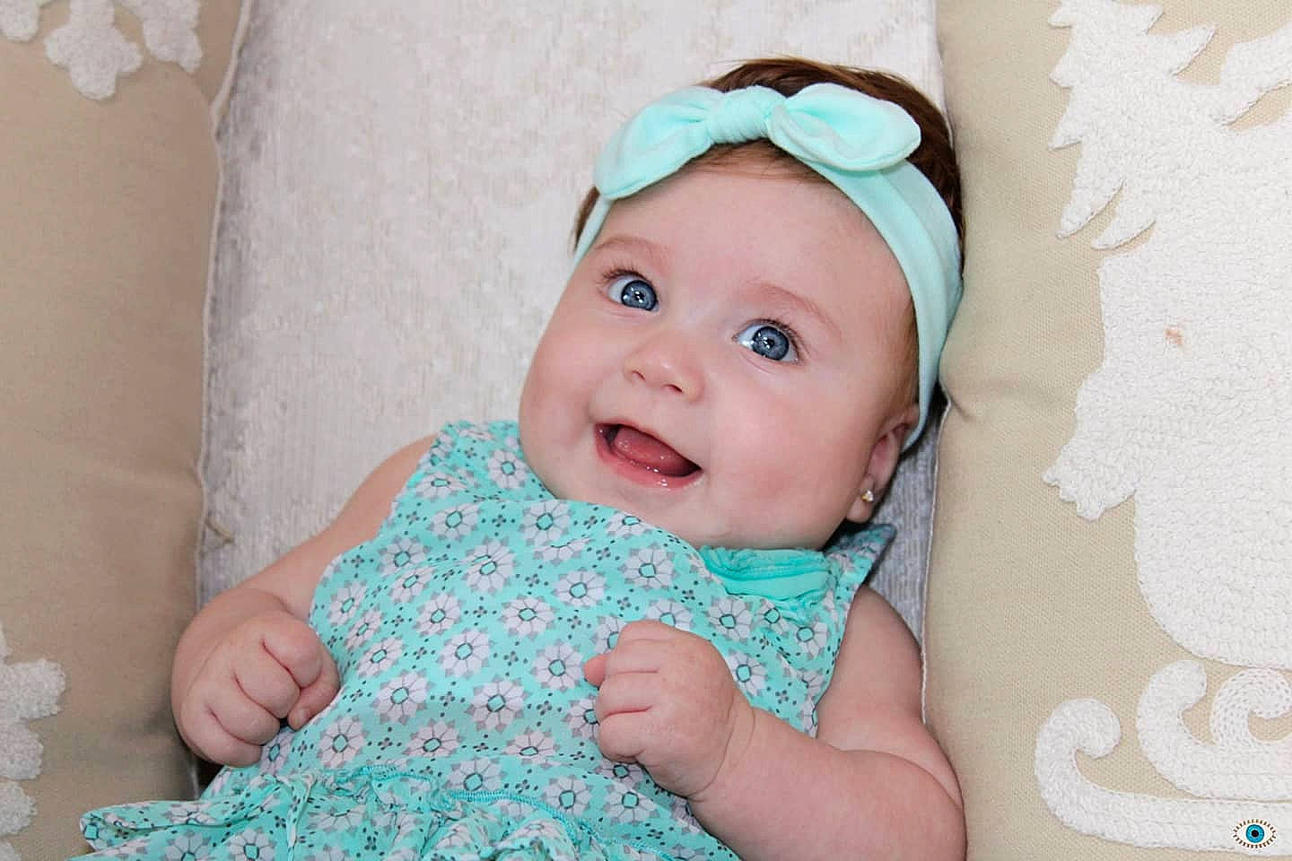 Kassandra joined the competition — help win amazing prizes! aqua, baby, baby_toddler_clothing, cap, cheek, child, collar, facial_expression, fashion_accessory, hair_accessory, happy, headgear, headwear, linens, pattern, person, pink, room, sleeve, smile