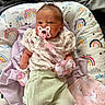 Aurora is registered to the contest to win money with this photo: baby, pacifier, mittens, cushion, rainbow_pattern, blanket, infant, clothing, pastel_colors, sleepwear, person, cute, newborn, resting, soft_fabric, indoors, portrait, small_person, lying_down, comfort
