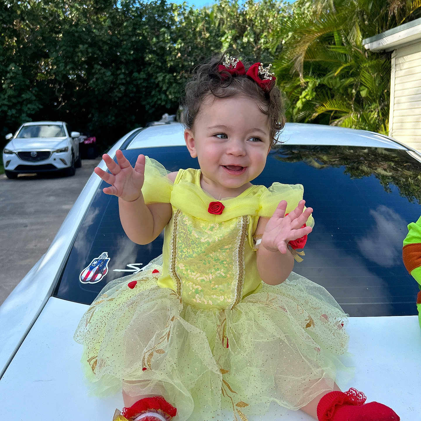 Alaiyah joined the competition — help win amazing prizes! architecture, baby, building, car, clothing, dress, face, head, outdoors, palmtree, person, photography, plant, portrait, sedan, shelter, summer, transportation, tree, vehicle