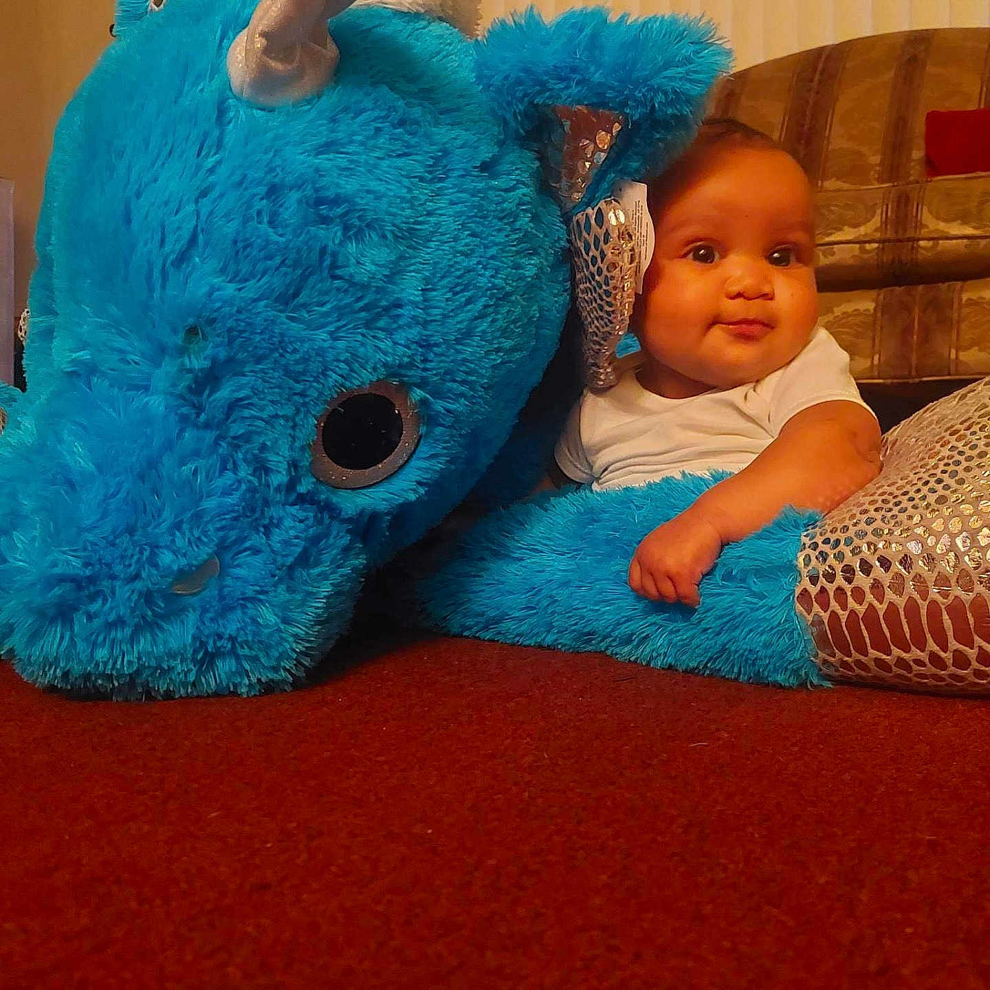 Brooklyn is registered to the contest to win money with this photo: architecture, baby, ball, building, couch, cushion, face, football, furniture, head, homedecor, indoors, person, photography, portrait, sitting, soccer, soccerball, sport, toy