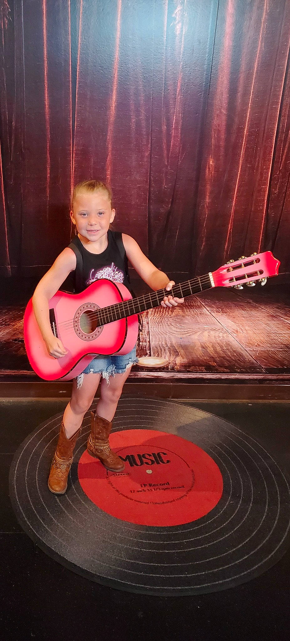 Delaney joined the competition — help win amazing prizes! ball, basketball, flash_photography, fun, guitar, guitar_accessory, human_leg, joy, knee, leg, leisure, musical_instrument, person, pink, plucked_string_instruments, shorts, sneakers, sports_equipment, string_instrument, string_instrument_accessory