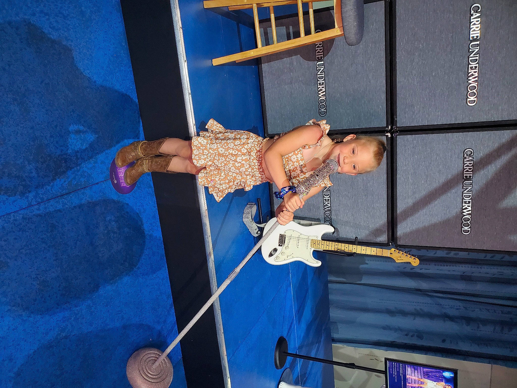 Delaney joined the competition — help win amazing prizes! blue, elbow, electric_blue, entertainment, event, fun, guitar, joy, leisure, metal, microphone, music, musical_instrument, musician, performance, performance_art, performing_arts, person, public_event, recreation