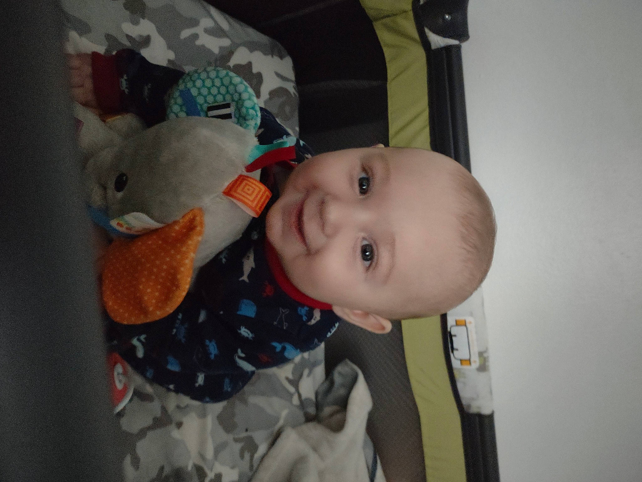 Dean is registered to the contest to win money with this photo: baby, baby_products, baby_toddler_clothing, cheek, child, comfort, eye, fun, happy, iris, joy, nose, pattern, person, room, skin, sleeve, smile, stuffed_toy, textile