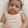 baby, infant, flower_crown, smile, soft_texture, blanket, cream_color, cute, portrait, young_child, lying_down, happy, baby_clothing, skin, headband, closeup, baby_girl, peaceful, adorable, child
