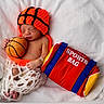 Emerson joined the competition — help win amazing prizes! newborn, baby, sleeping, basketball, plush_toy, knit_hat, net_pants, sports_bag, red, orange, white_blanket, cute, infant, sleep, soft, cozy, child, resting, toy, portrait
