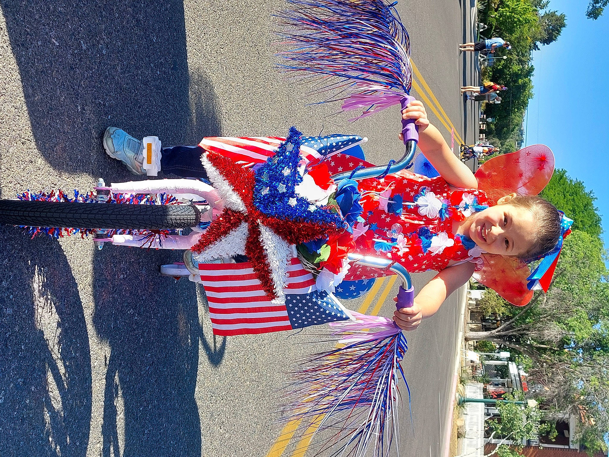 Leela is registered to the contest to win money with this photo: azure, blue, carmine, costume, costume_design, electric_blue, entertainment, event, festival, fun, happy, joy, leisure, performance_art, performing_arts, person, pole, public_event, sky, tradition