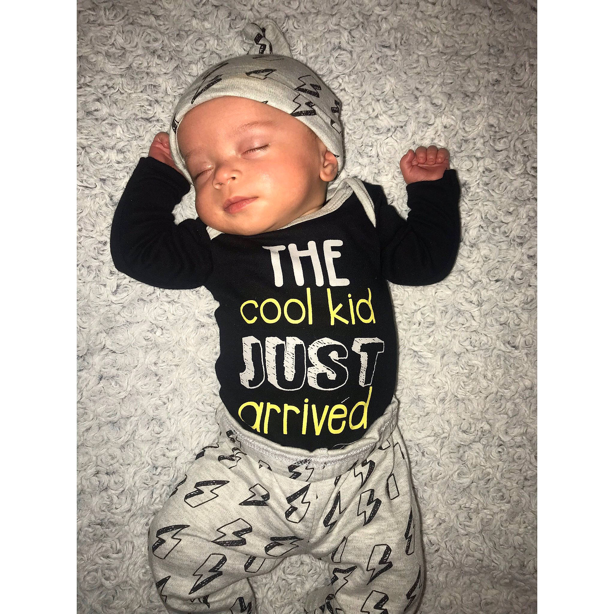 Braylon is registered to the contest to win money with this photo: baby, baby_toddler_clothing, cap, child, cool, happy, headgear, headwear, hood, hoodie, jacket, outerwear, person, photo_caption, product, shirt, sleeve, smile, t_shirt, toddler