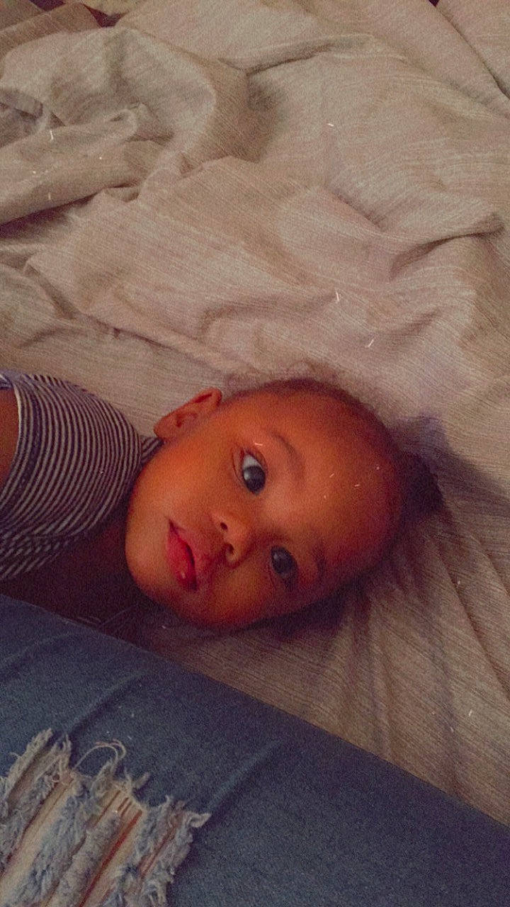 Keon is registered to the contest to win money with this photo: baby, baby_toddler_clothing, bed_sheet, bedtime, cheek, child, comfort, flesh, iris, linens, lip, mouth, peach, person, portrait_photography, skin, textile, toddler