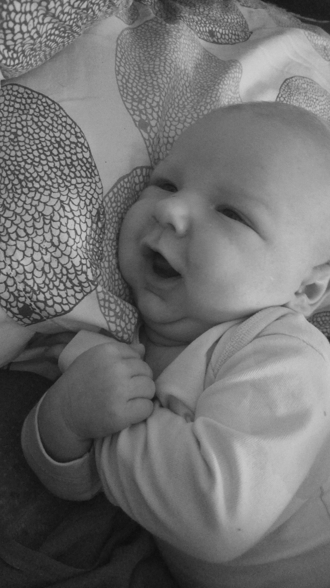 Kameron participe au concours pour gagner de l'argent avec cette photo : abdomen, baby, baby_toddler_clothing, cheek, chest, child, comfort, elbow, gesture, grass, happy, human_leg, monochrome, monochrome_photography, pattern, person, photography, portrait_photography, sitting, skin