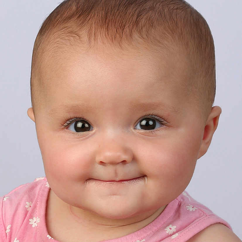 Inaya participe au concours pour gagner de l'argent avec cette photo : apparel, baby, baby_girl, cheeks, child, closeup, cute, expression, eyes, face, flower_pattern, head, infant, person, pink_clothing, portrait, skin, smile, studio, young_child
