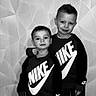 child, children, boys, matching_clothing, nike, sweatshirts, black_and_white, portrait, indoor, wall, geometric_pattern, smiling, posing, siblings, casual_wear, young, friendship, happy, fashion, standing