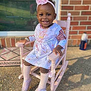 Memorie is registered to the contest to win money with this photo: chair, child, clothing, dress, face, female, footwear, furniture, girl, hair, head, pants, person, photography, portrait, rockingchair, shoe, sitting, sleeve, standing