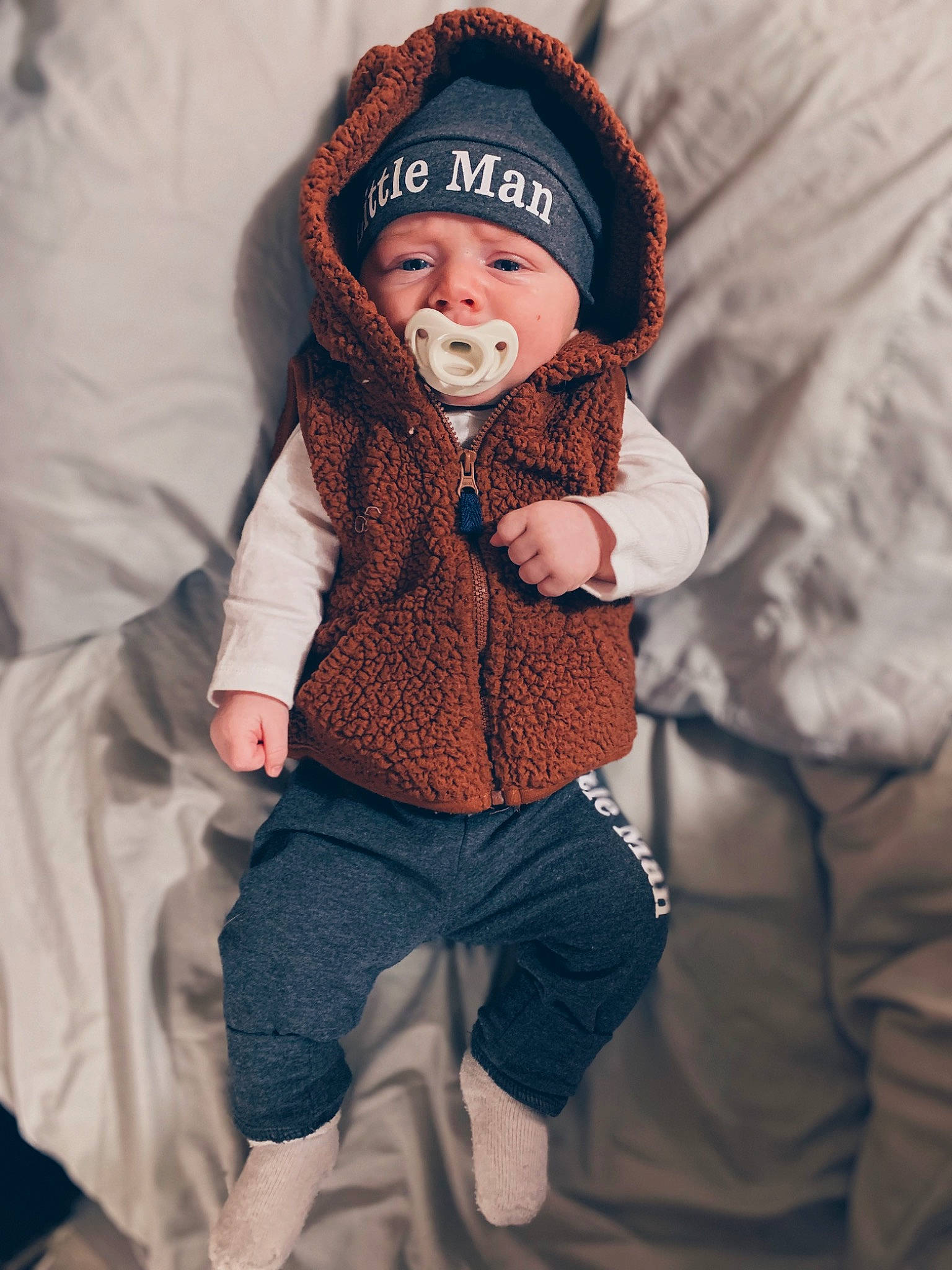 Kaison is registered to the contest to win money with this photo: baby, baby_toddler_clothing, beanie, cap, child, comfort, face, fun, fur, gesture, happy, headwear, hood, knit_cap, outerwear, pattern, person, sleeve, smile, textile