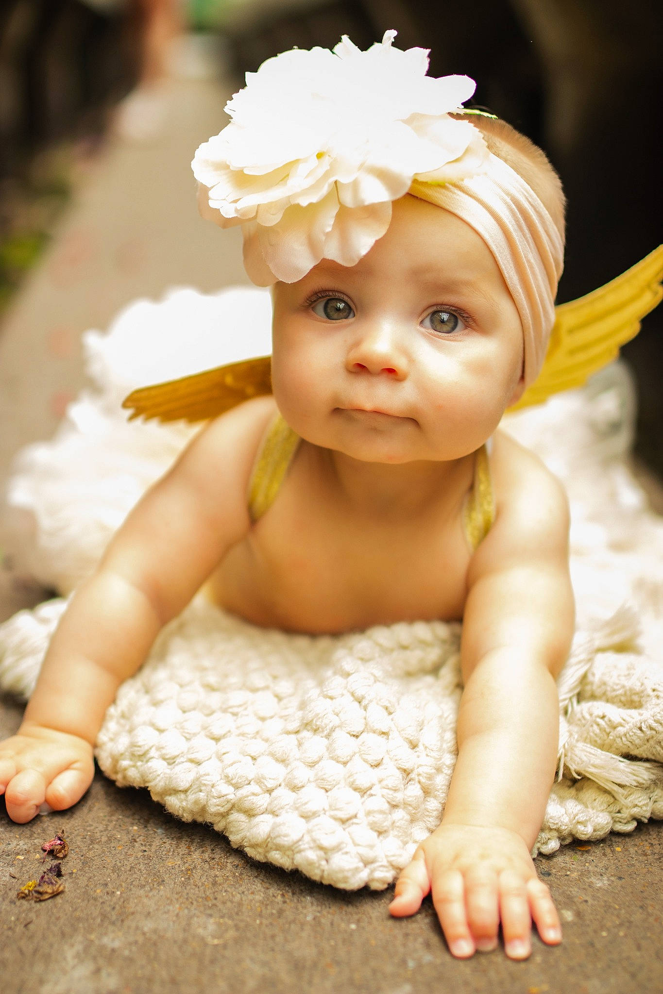 Genesis is registered to the contest to win money with this photo: baby, baby_toddler_clothing, cap, child, eye, flash_photography, flower, grass, hair_accessory, happy, headband, headgear, headpiece, headwear, iris, peach, person, petal, plant, skin