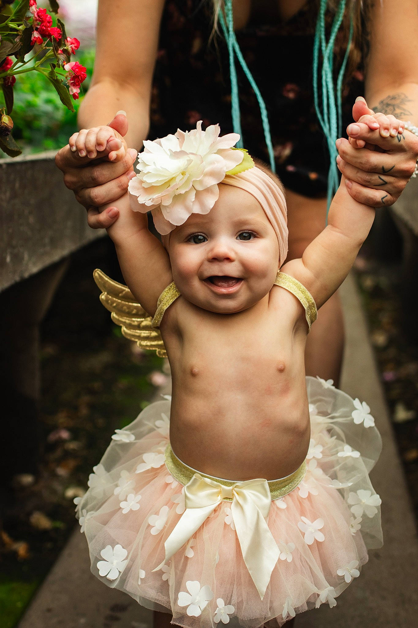 Genesis is registered to the contest to win money with this photo: baby, bridal_accessory, child, cut_flowers, event, flower, gesture, grass, hair_accessory, happy, head, headband, headgear, headpiece, headwear, jewellery, joy, person, petal, pink