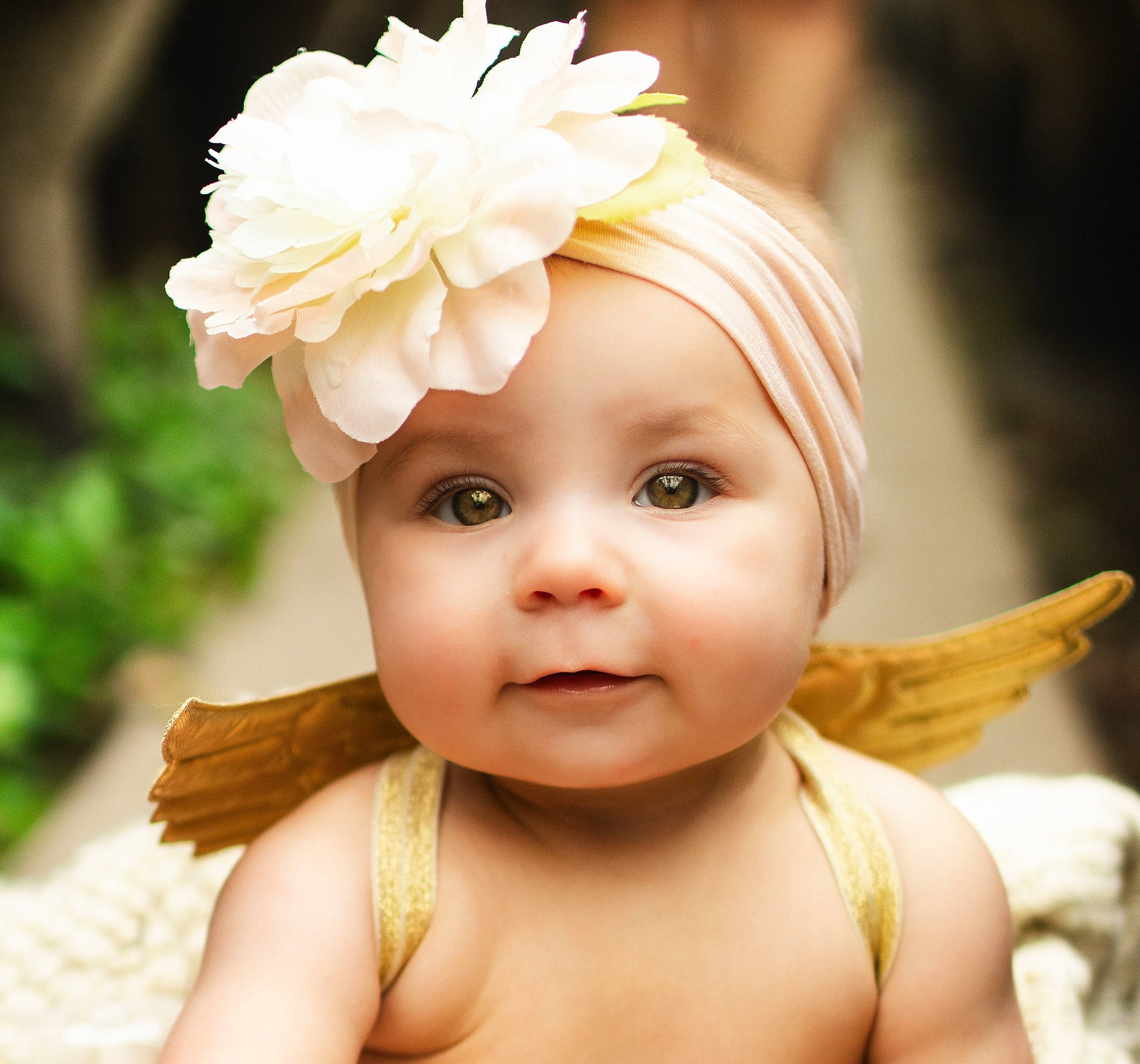 Genesis is registered to the contest to win money with this photo: baby_toddler_clothing, ear, eye, eyebrow, eyelash, fawn, finger, flower, forehead, hair, happy, head, headgear, headpiece, headwear, human_body, iris, person, petal, pink